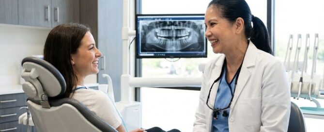 Dentist explaining tooth bonding process to patient in Alexandria VA clinic