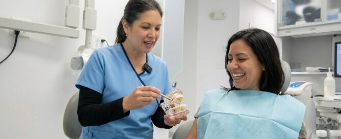 Smiling patient consulting dentist about affordable veneers options in Woodbridge VA